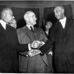 This photograph of President Harry S. Truman with John W. Mays, right, and Samuel C. Jackson, left, was taken by Harris & Ewing on March 4, 1950. President Truman is captured celebrating Mays and Jackson for their 41 years of working at the White House. Truman presented Mays and Jackson with autographed dollar bills to honor their milestone.