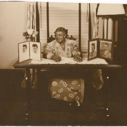 Elizabeth McDuffie seated at a desk, circa 1960 
